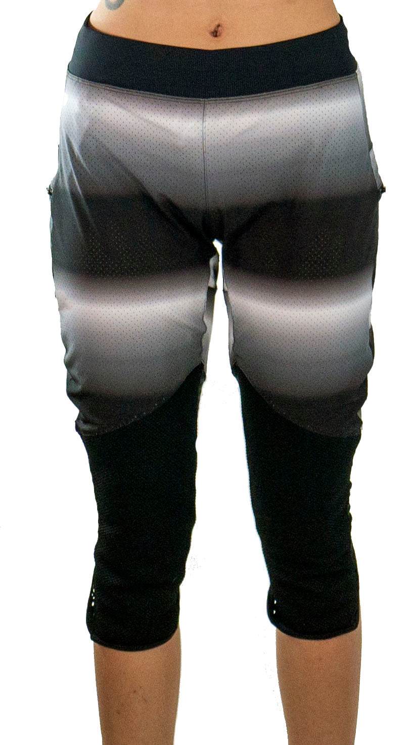 Bike pants with removable G-Form knee pads in black and gray gradient, designed for durable, breathable all-year-round mountain biking.